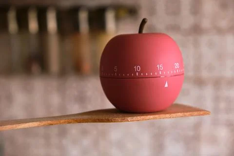 Kitchen timer shaped like a apple on kitchen Stock Photos
