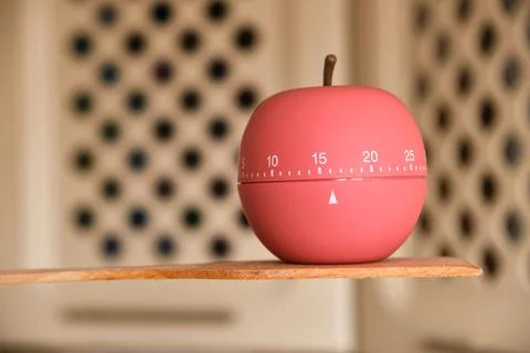 Kitchen timer shaped like a apple on kitchen Stock Photos
