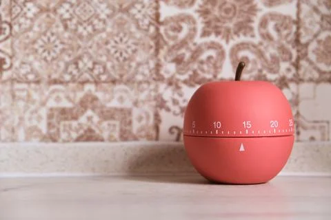 Kitchen timer shaped like a apple on kitchen Stock Photos