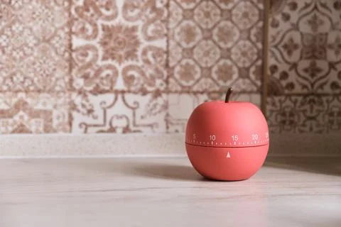Kitchen timer shaped like a apple on kitchen Stock Photos