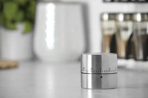 Kitchen timer on white table indoors. Space for text Stock Photos