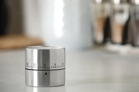 Kitchen timer on white table indoors. Space for text Stock Photos