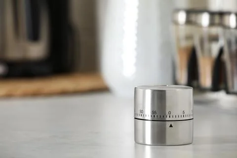 Kitchen timer on white table indoors. Space for text Stock Photos