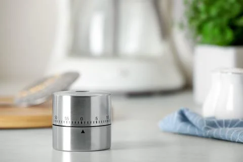 Kitchen timer on white table indoors. Space for text Stock Photos