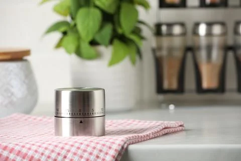 Kitchen timer on white table. Space for text Stock Photos