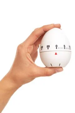 Kitchen timer in woman's hand Stock Photos