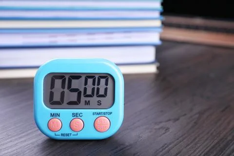 Kitchen timer on wooden table, closeup. Space for text Stock Photos