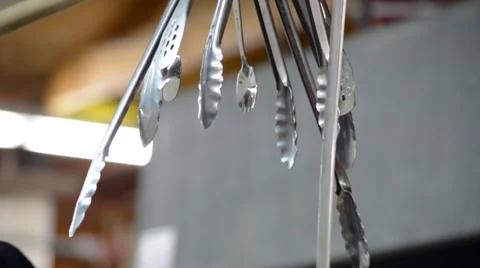 Kitchen Tongs Hanging from Hooks Stock-Footage 58103990