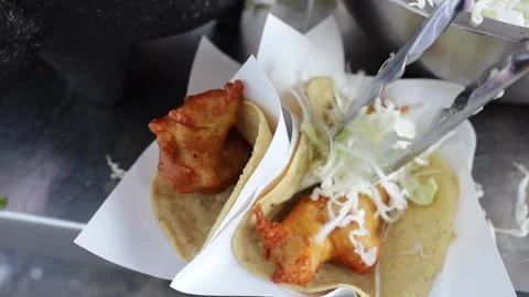 Kitchen Tongues Serving Cole on Top Of a Shrimp Taco. (Slow Motion, Top View) Video stock 166650378