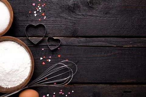 Kitchen tools, flour and sugar on a wooden background Stock Photos