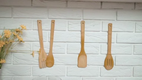 Kitchen tools hang on nails on the wall.  Stock Footage 222363784