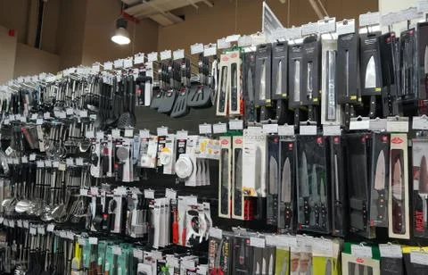 Kitchen Tools Hanging In Shop. Large Set And Variety Of Different Manufacture Фото