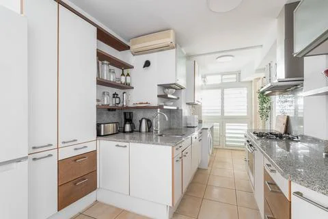 Kitchen unit with different cabinets and cooking appliances 스톡 사진