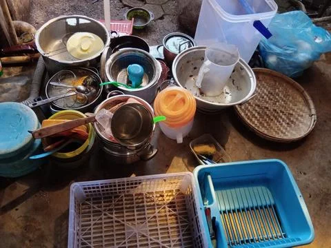 Kitchen Utensils and Cookware Ready for Washing Stock Photos