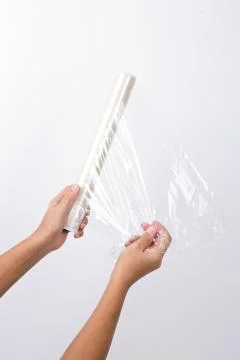 Kitchen utensils and tools, hand with stretch film Stock Photos