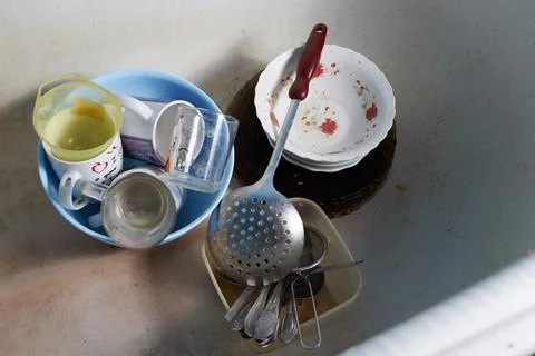 Kitchen utensils need to be washed, dirty dishes in the kitchen Stock Photos