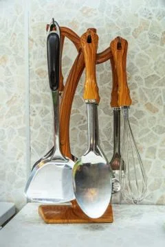 Kitchen utensils on a stand on table Stock Photos