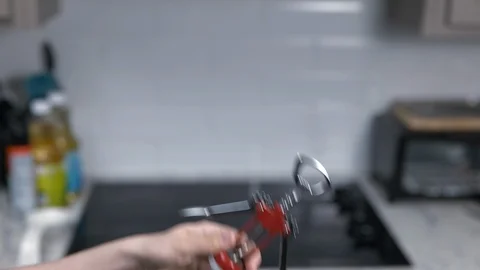 Kitchen Utensils with Stovetop as backdrop Stock Footage 120660751