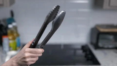 Kitchen Utensils with Stovetop as backdrop Stock Footage 120661193