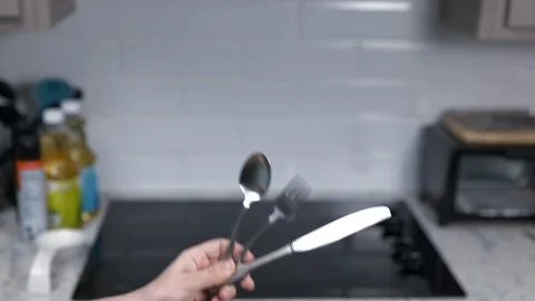 Kitchen Utensils with Stovetop as backdrop Stock Footage 120662610