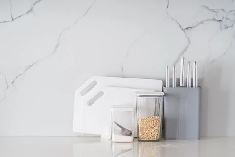 Kitchen utensils on white table Stock Photos