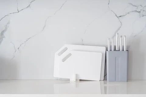 Kitchen utensils on white table Stock Photos