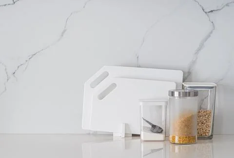 Kitchen utensils on white table Stock Photos