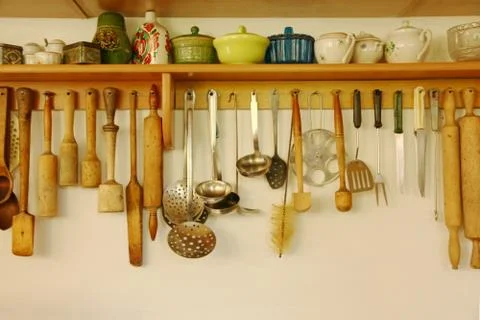 Kitchen ware hanging on the wall. Stock Photos