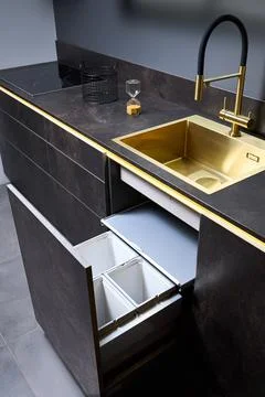 Kitchen waste bin cabinet. Pull out kitchen drawer for waste bin separate waste Stock Photos