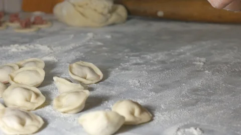 In the kitchen we make dumplings, hand-made flour and meat Stock Footage 111911538