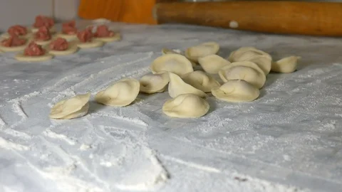 In the kitchen we make dumplings, hand-made flour and meat Stock Footage 111912910