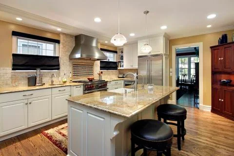 Kitchen with white cabinetry Foto stock