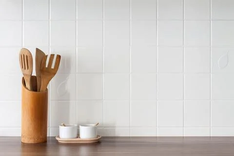 Kitchen with white tiles on the wall. Kitchen tools. Copy space. Stock Photos