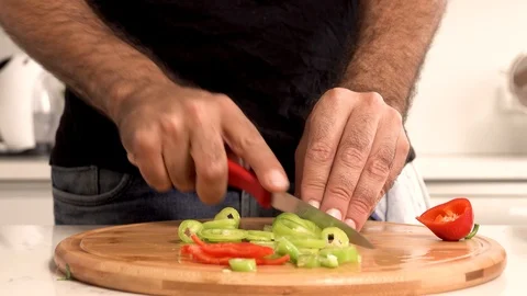 Kitchen work, salad cutting, cooking, man cooking, man's hand cutting salad 動画素材 120677842