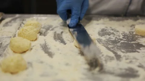 Kitchen worker cooking cheesecakes with cottage cheese Stock Footage 166584090
