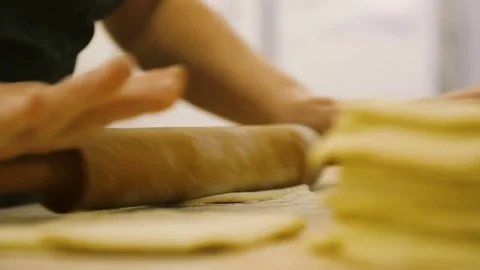 Kitchen worker prepares the dough for buns Stock Footage 69778596