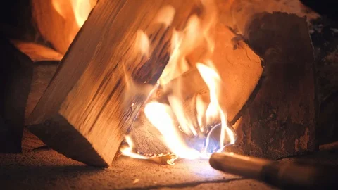 Kitchen worker sets fire to firewood using gas-burner Video stock 126950996