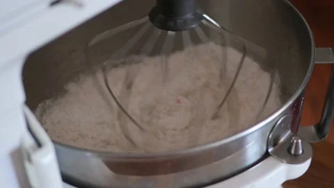 A KitchenAid counter top stand mixer whisking together funfetti birthday Stock Footage 150342039