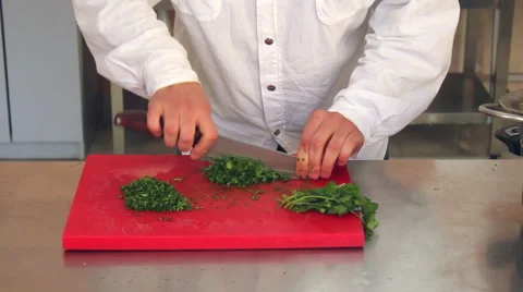 Kitchener chopping lush greenery Stock Footage 64801612