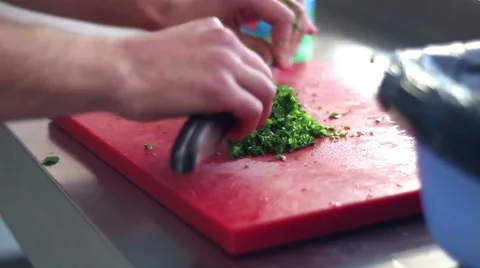 Kitchener chopping lush greenery Stock Footage 64801643