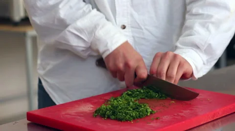 Kitchener chopping lush greenery Stock Footage 64801660