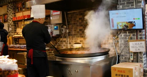 Kitchener shows live making famous Chongqing beef tallow hot pot seasoning Stock Footage 124454070