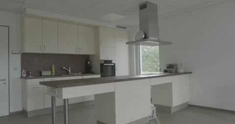 Kitchenette With Coffee Machine and Range Hood, Office Break Room, Slow Pan Stock Footage 340360595