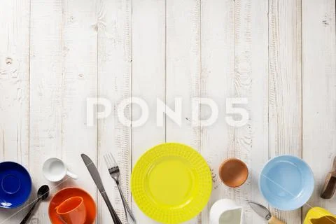 Kitchenware and crockery at wooden background Stock Photos