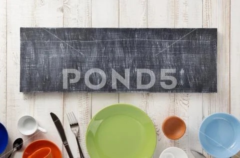 Kitchenware and crockery at wooden background Stock Photos