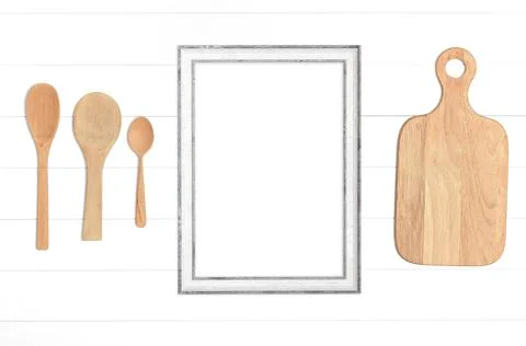 Kitchenware and empty wooden frame on white background 写真素材