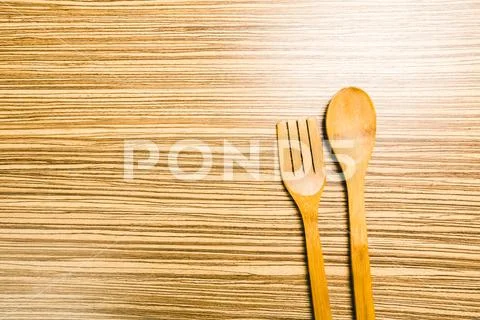 Kitchenware on wooden background Stock Photos