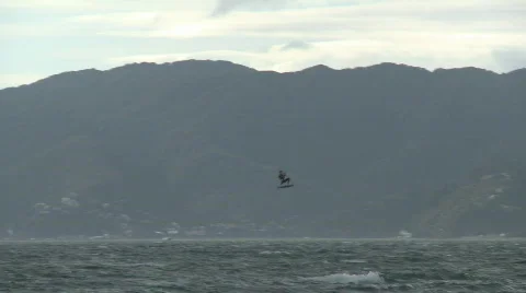 Kite boarder performs a jump Stock Footage 753242