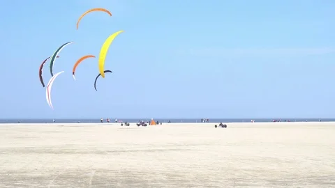 Kite buggy race at beach of Sankt Peter-Ording in Germany Stock Footage 106982577