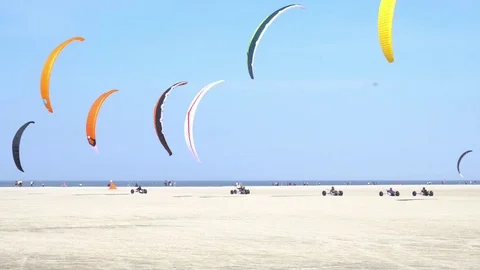 Kite buggy race at beach of Sankt Peter-Ording in Germany Stock Footage 106982643
